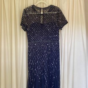 Evening dress in midnight blue chiffon, lined with sequins and beading details.